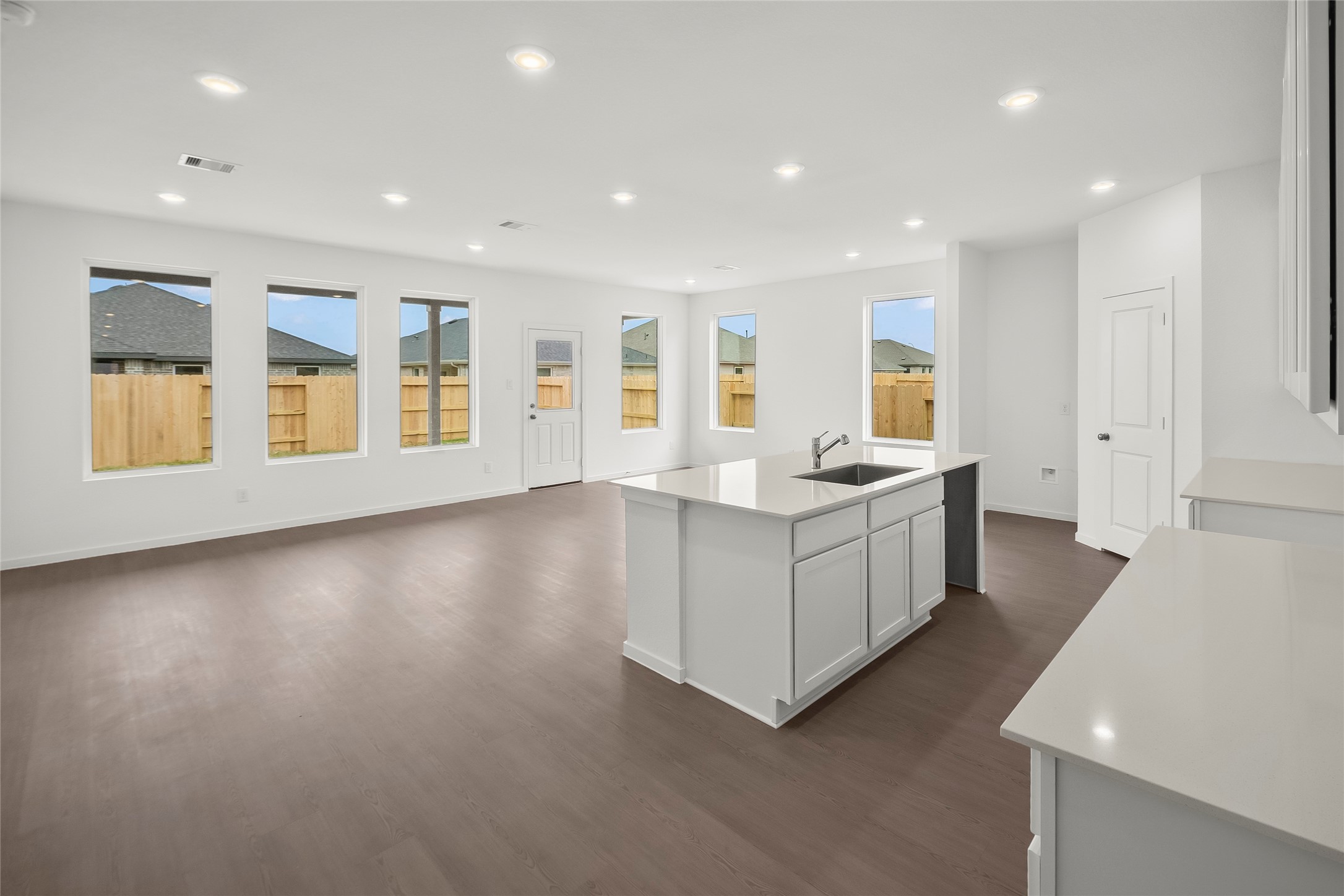 7750 Montana Ruby Drive Rosharon, TX 77583 - Photo 2 of 31 a view of a kitchen with center island and wooden floor