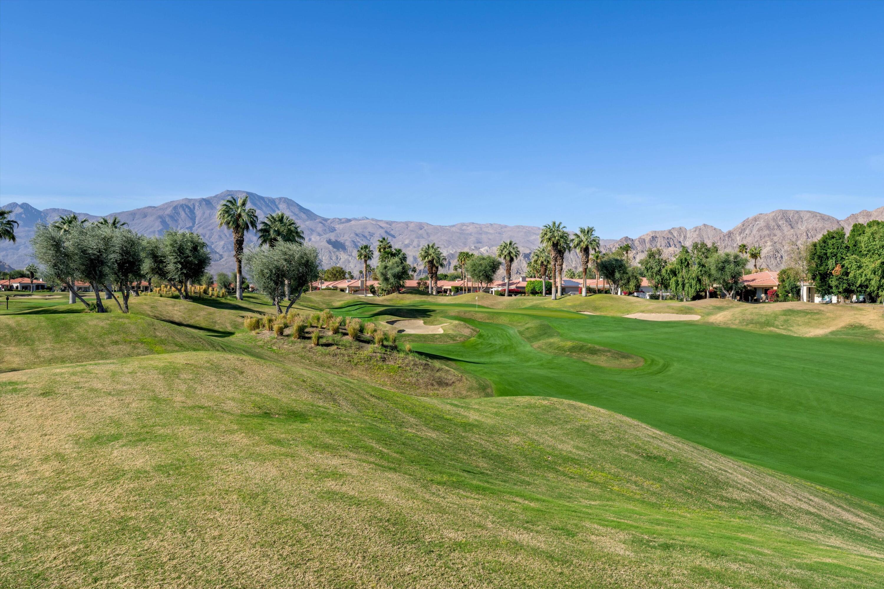 55151 Laurel Valley La Quinta, CA 92253 - Photo 13 of 43 a view of a golf course with a building