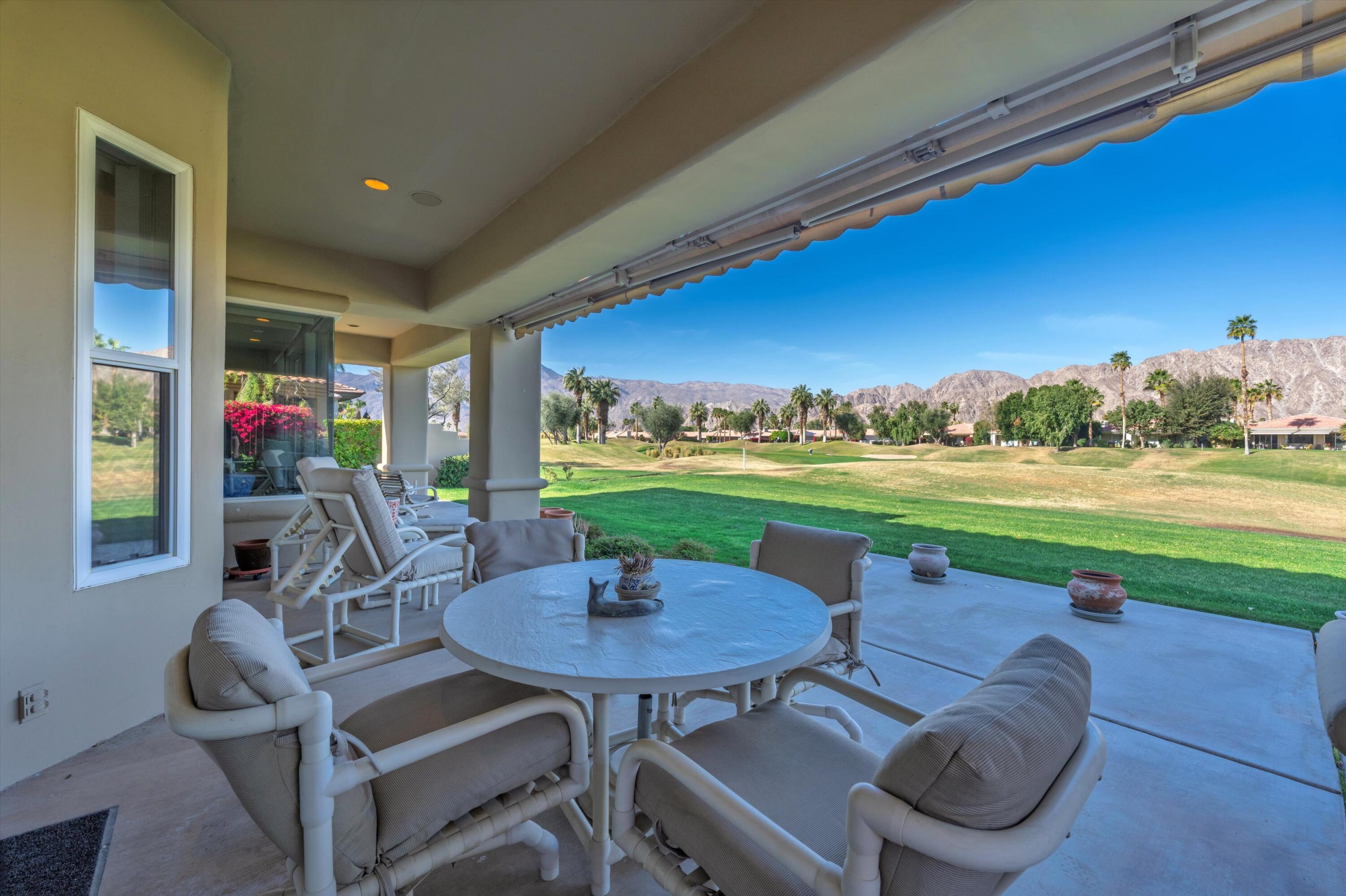 55151 Laurel Valley La Quinta, CA 92253 - Photo 16 of 43 a view of a patio with table and chairs and potted plants