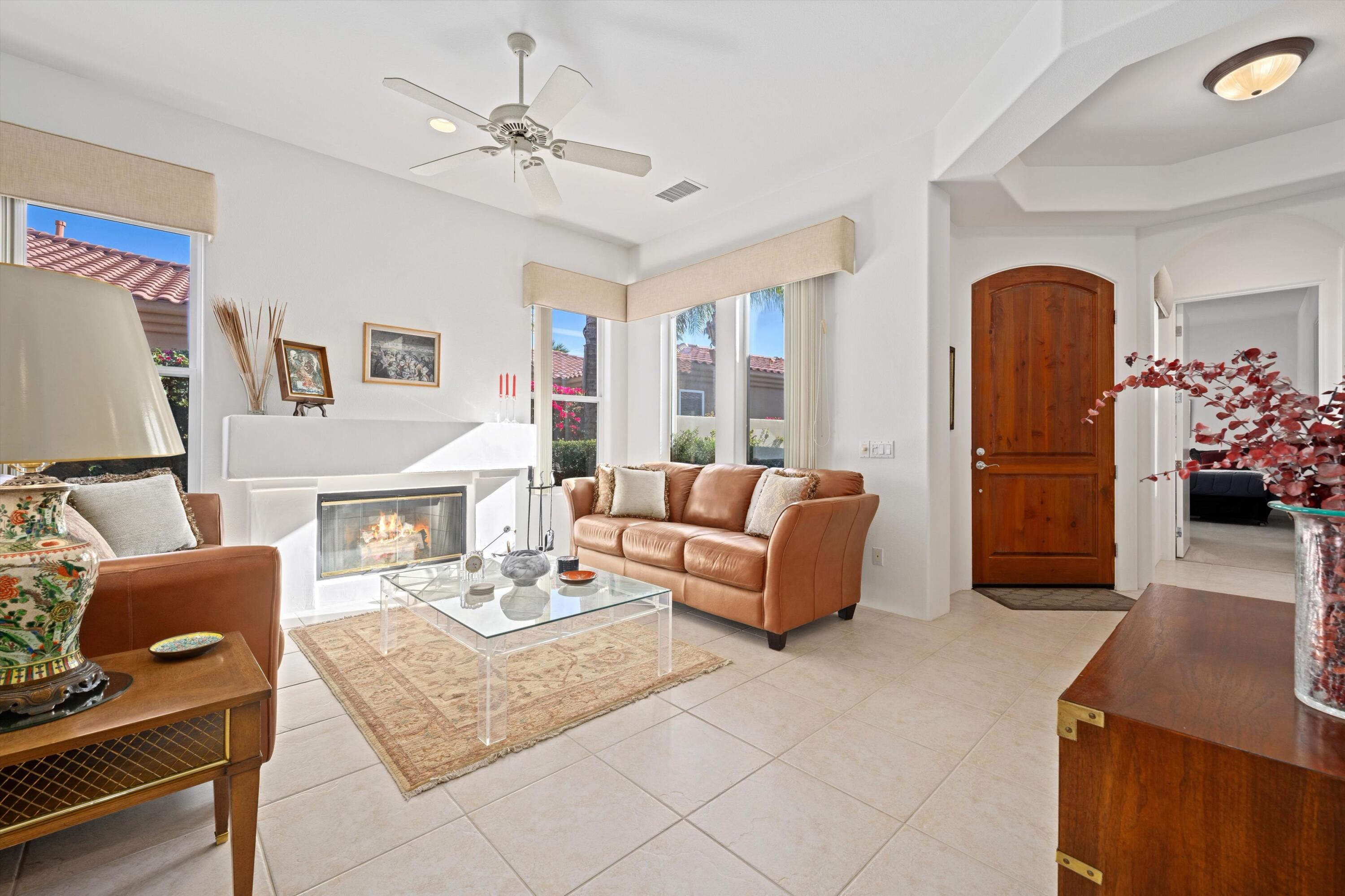 55151 Laurel Valley La Quinta, CA 92253 - Photo 17 of 43 a living room with furniture and a chandelier