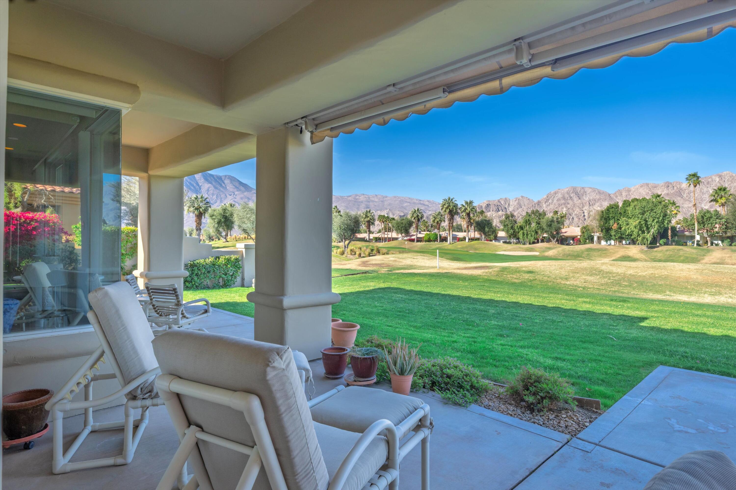 55151 Laurel Valley La Quinta, CA 92253 - Photo 2 of 43 a view of a chairs and table in patio with a yard