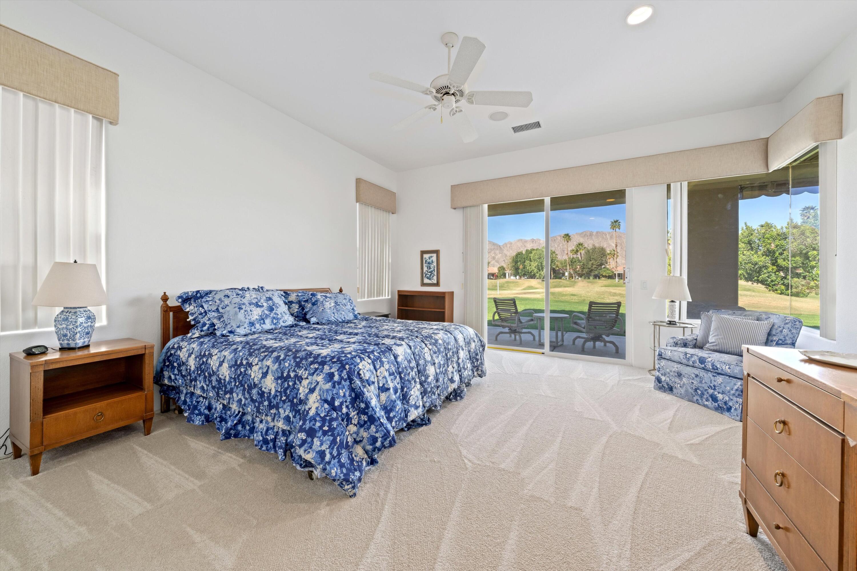 55151 Laurel Valley La Quinta, CA 92253 - Photo 30 of 43 a bedroom with a bed and a large window