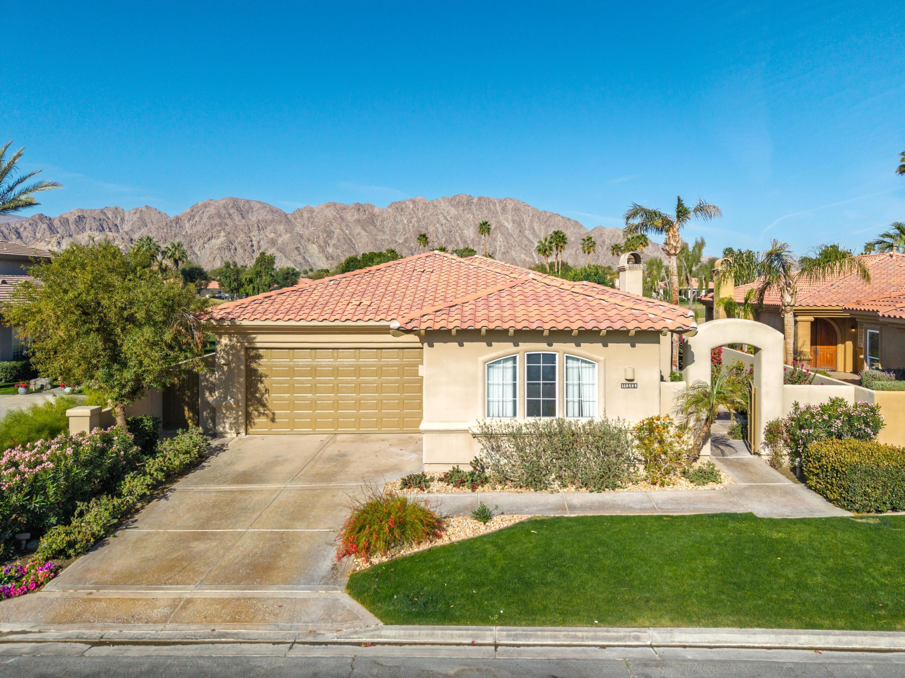 55151 Laurel Valley La Quinta, CA 92253 - Photo 34 of 43 a front view of a house with garden