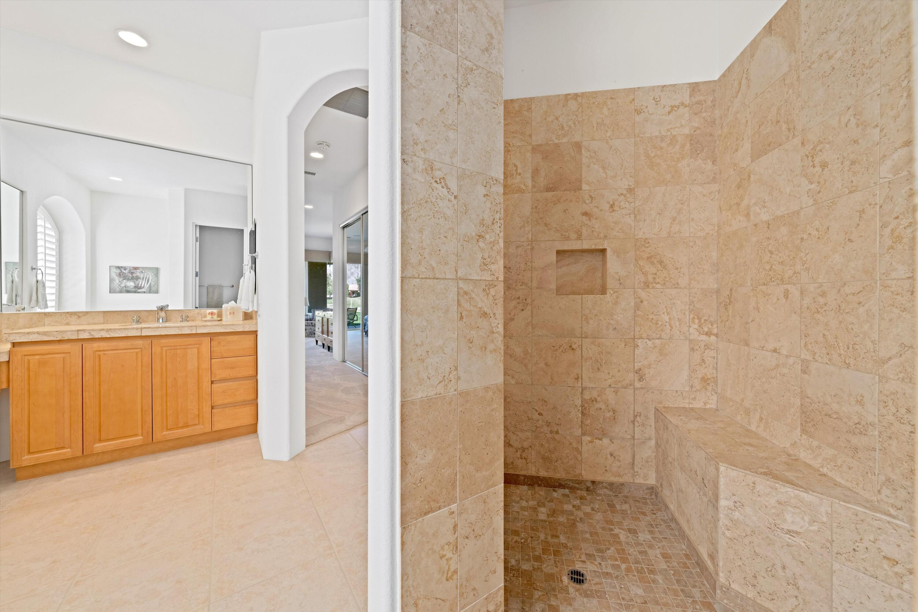 55151 Laurel Valley La Quinta, CA 92253 - Photo 35 of 43 a bathroom with a sink and a mirror