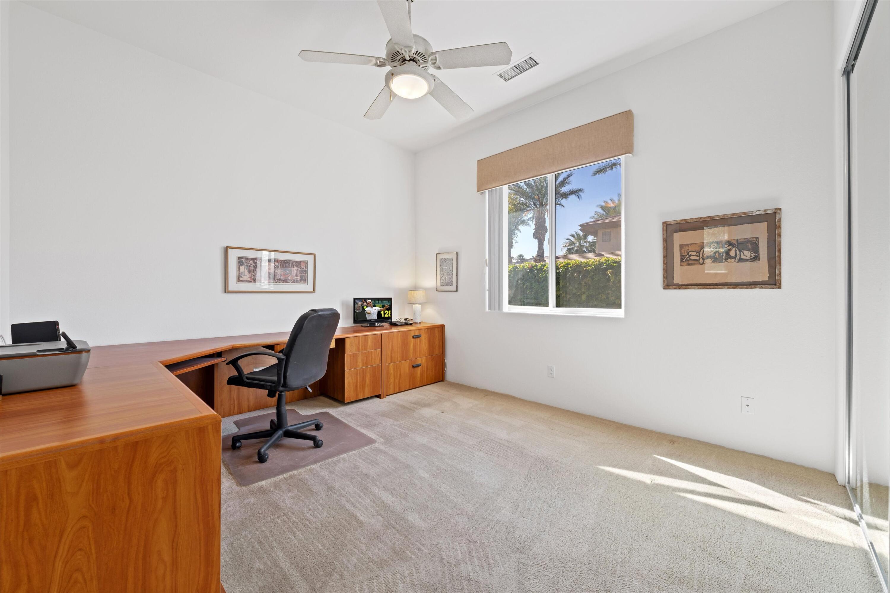 55151 Laurel Valley La Quinta, CA 92253 - Photo 36 of 43 a view of a workspace with furniture and a window