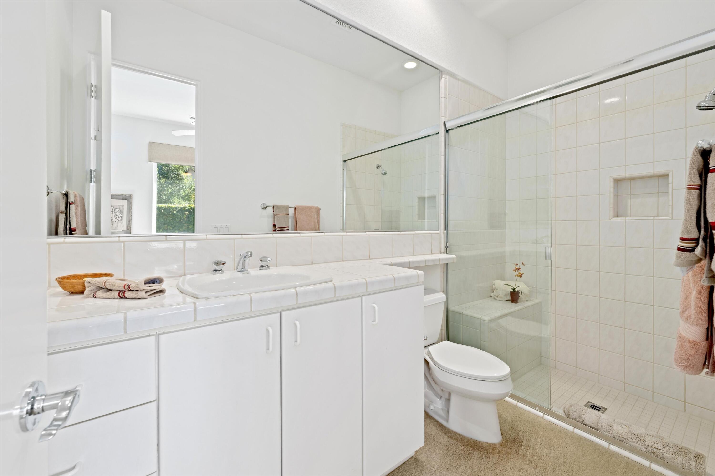 55151 Laurel Valley La Quinta, CA 92253 - Photo 37 of 43 a bathroom with a sink toilet and shower