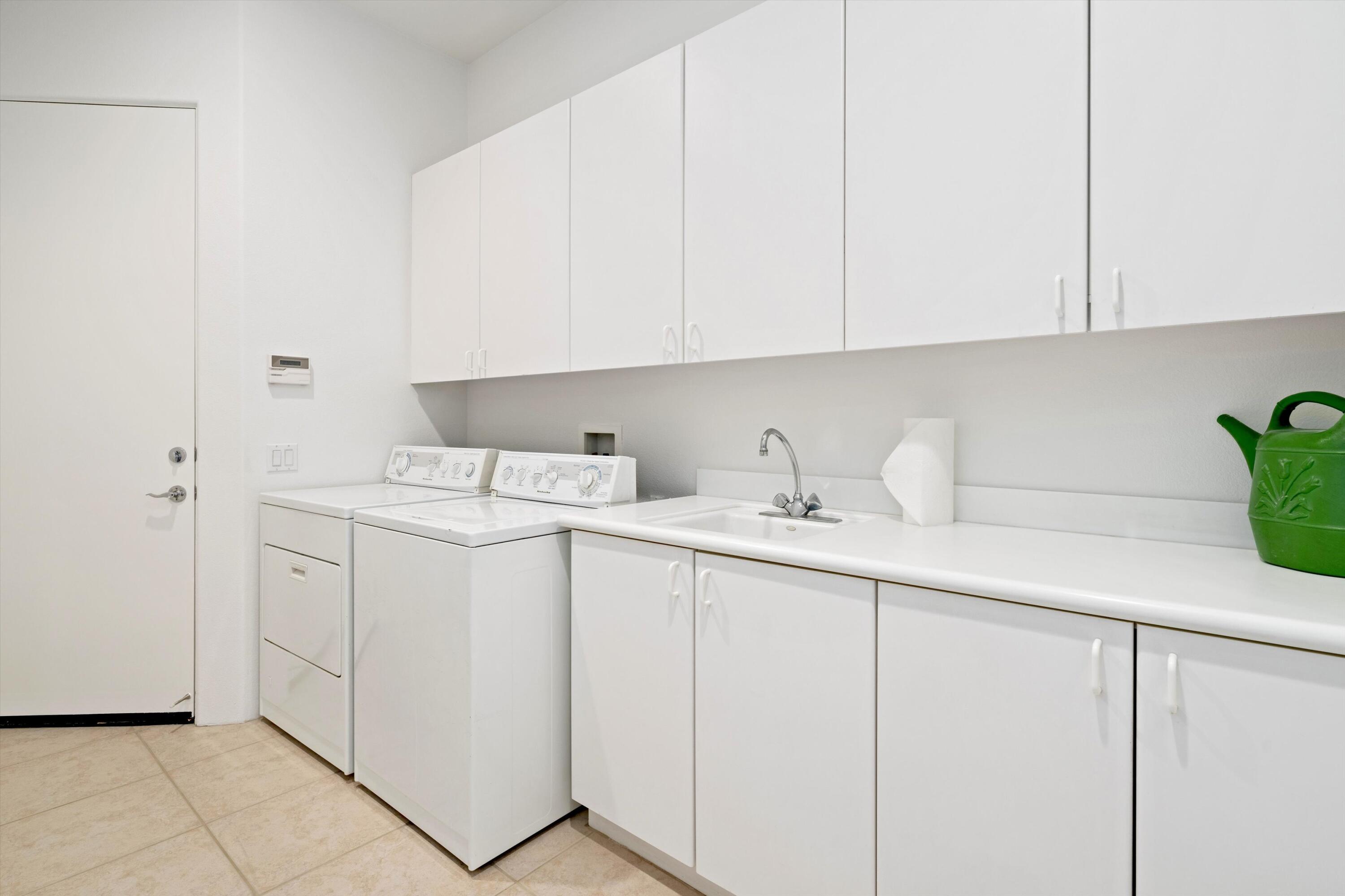 55151 Laurel Valley La Quinta, CA 92253 - Photo 40 of 43 a utility room with sink dryer and washer