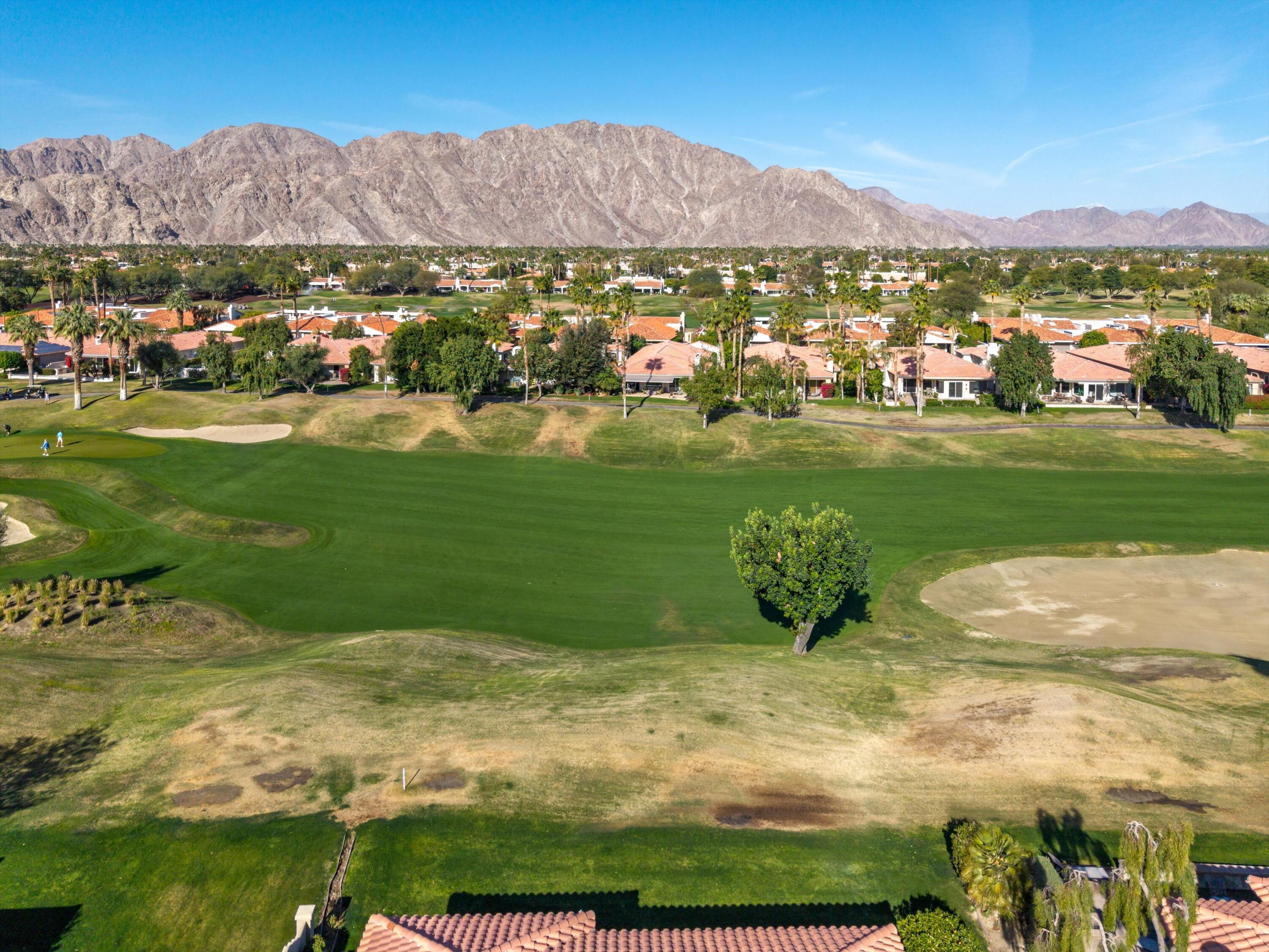 55151 Laurel Valley La Quinta, CA 92253 - Photo 5 of 43 a view of a table and chairs in the garden