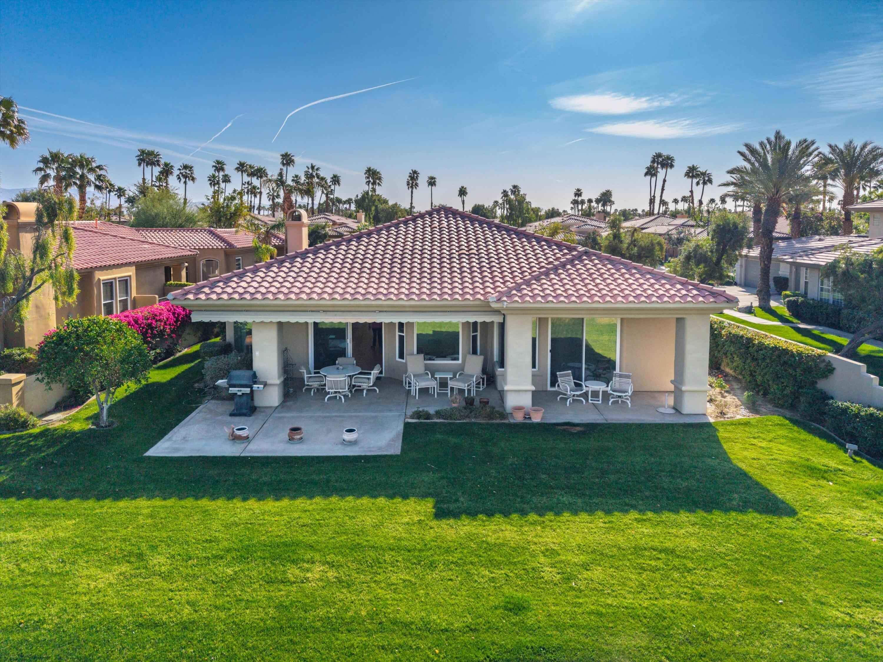 55151 Laurel Valley La Quinta, CA 92253 - Photo 8 of 43 a front view of a house with a garden
