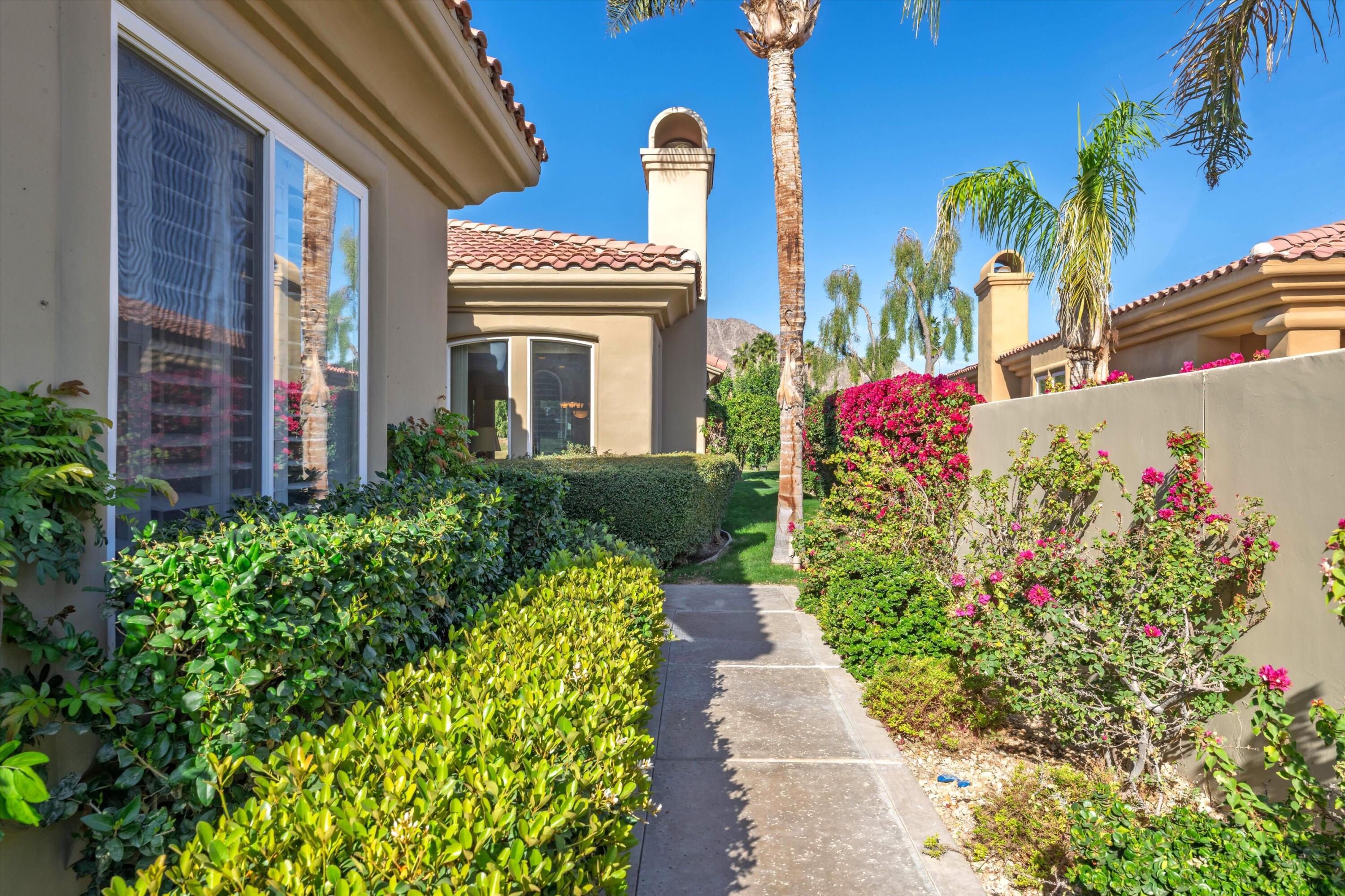 55151 Laurel Valley La Quinta, CA 92253 - Photo 10 of 43 a front view of a house with a yard and fountain