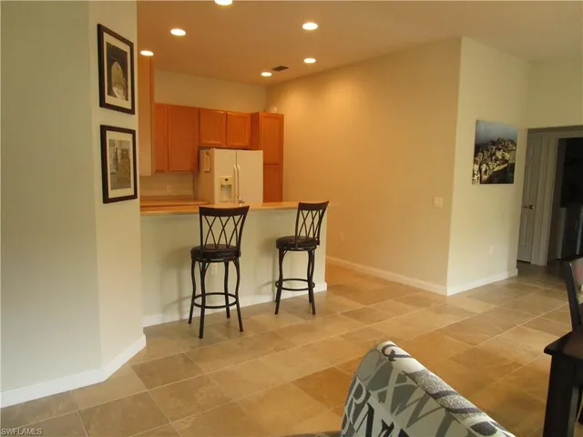 a bathroom with a double vanity sink a shower and a mirror