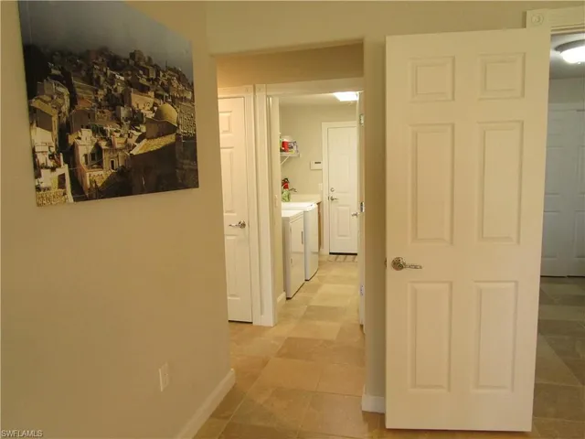 a bathroom with a shower and a glass door