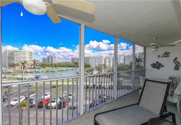 a view of a balcony with chairs