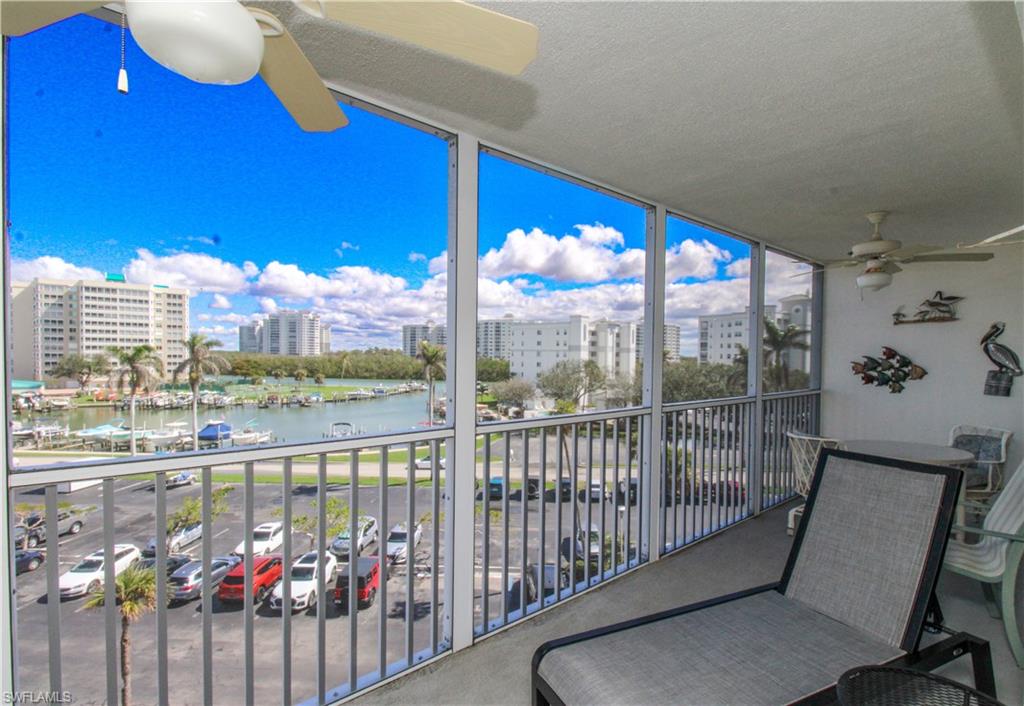 a view of a balcony with chairs