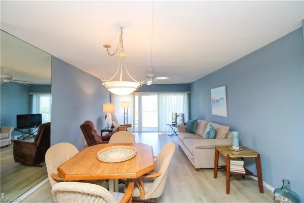 a bedroom with furniture and wooden floor