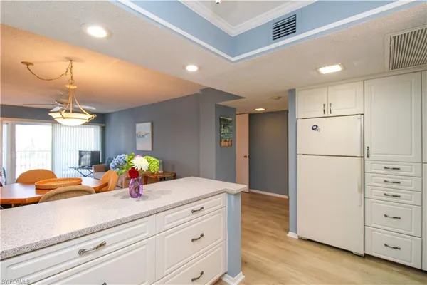 a kitchen with stove a microwave and cabinets