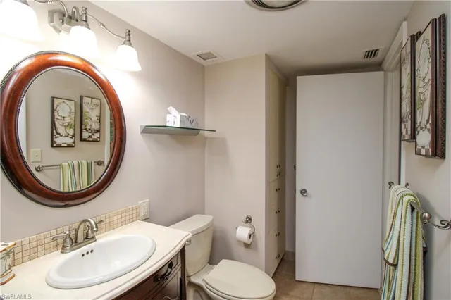 a bedroom with two beds and a dresser