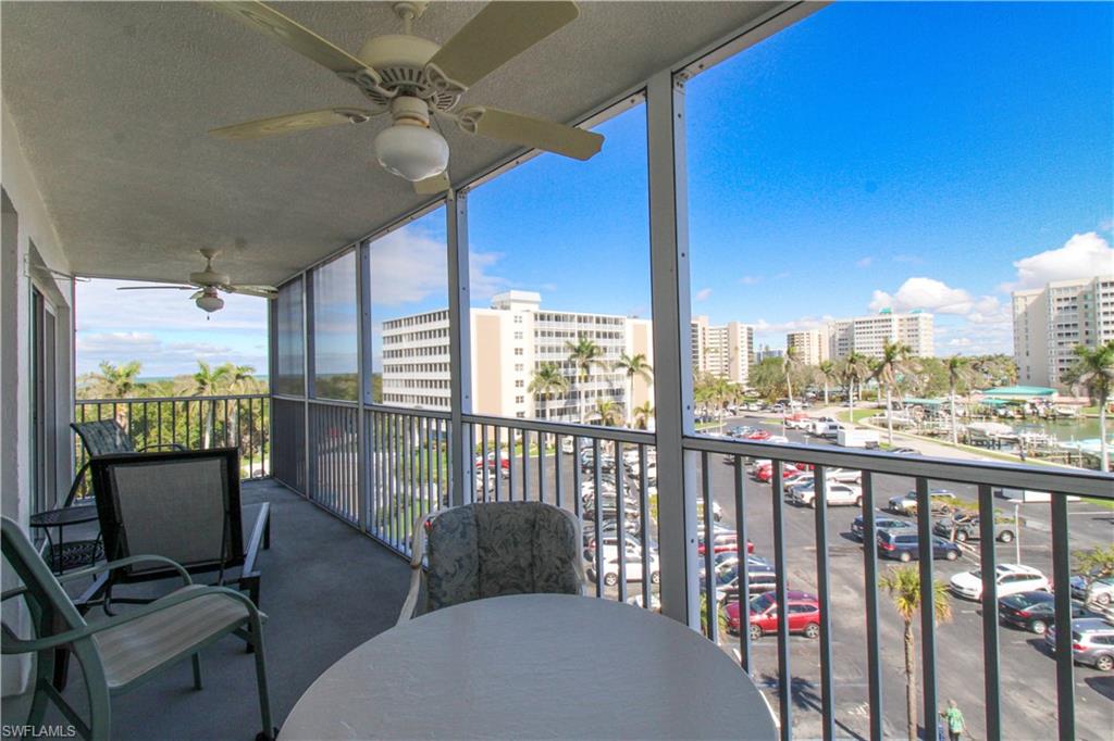 1 Bluebill Avenue, Unit 501 Naples, FL 34108 - Photo 24 of 38 a view of a balcony with chairs