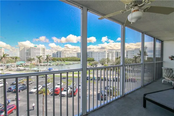 a view of a balcony with chairs