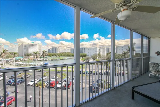 a view of a balcony with chairs