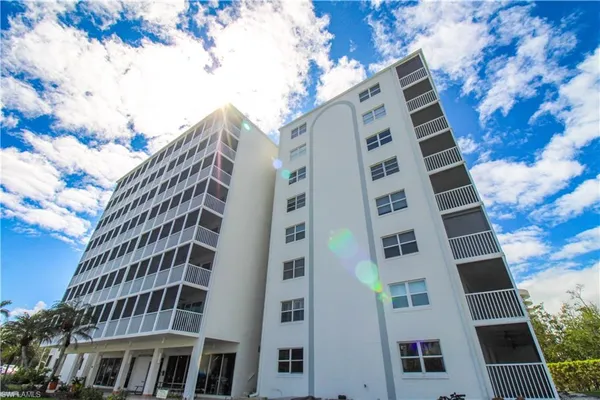 a view of a building with a yard