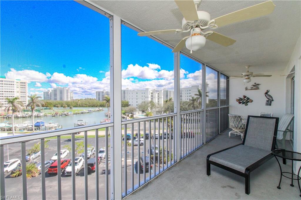 1 Bluebill Avenue, Unit 501 Naples, FL 34108 - Photo 3 of 38 a living room with furniture and a floor to ceiling window