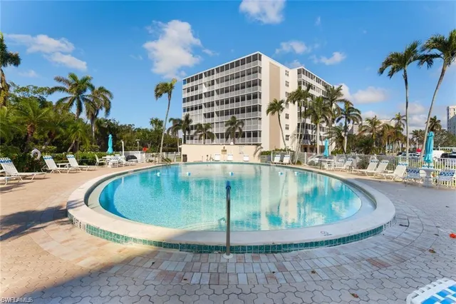 a view of a swimming pool with a lounge chairs