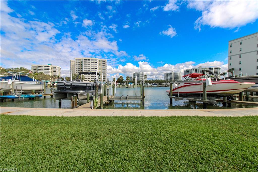 1 Bluebill Avenue, Unit 501 Naples, FL 34108 - Photo 33 of 38 a view of a playground and patio