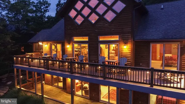 a view of a house with a patio and a garden