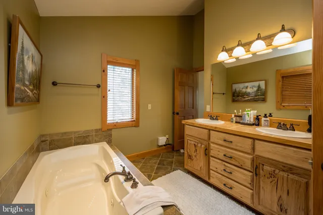 a bathroom with a bathtub and a shower