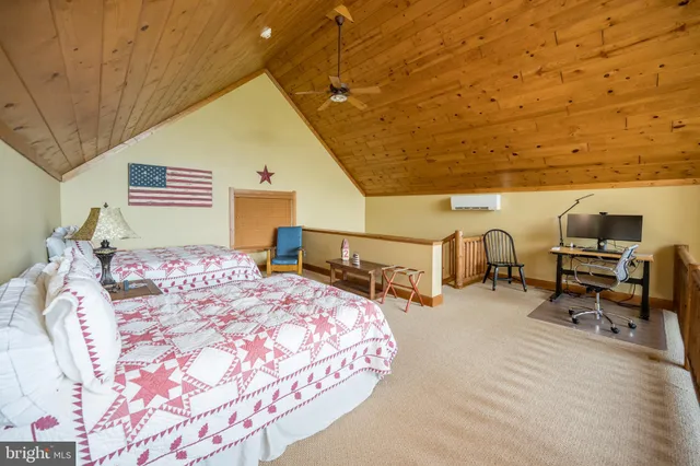 a bedroom with bed and a window