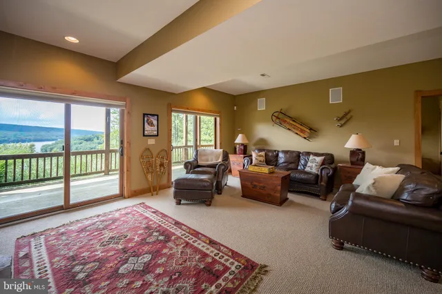 a living room with furniture and a rug