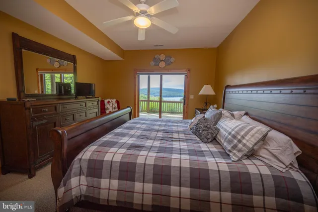 a bed room with a bed and a chandelier