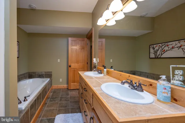 a white bath tub sitting in a bathroom
