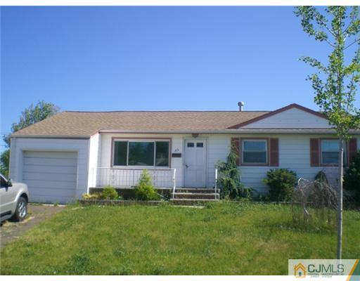 35 Harrison Avenue Carteret, NJ 07008 - Photo 1 of 1 a front view of a house with a yard