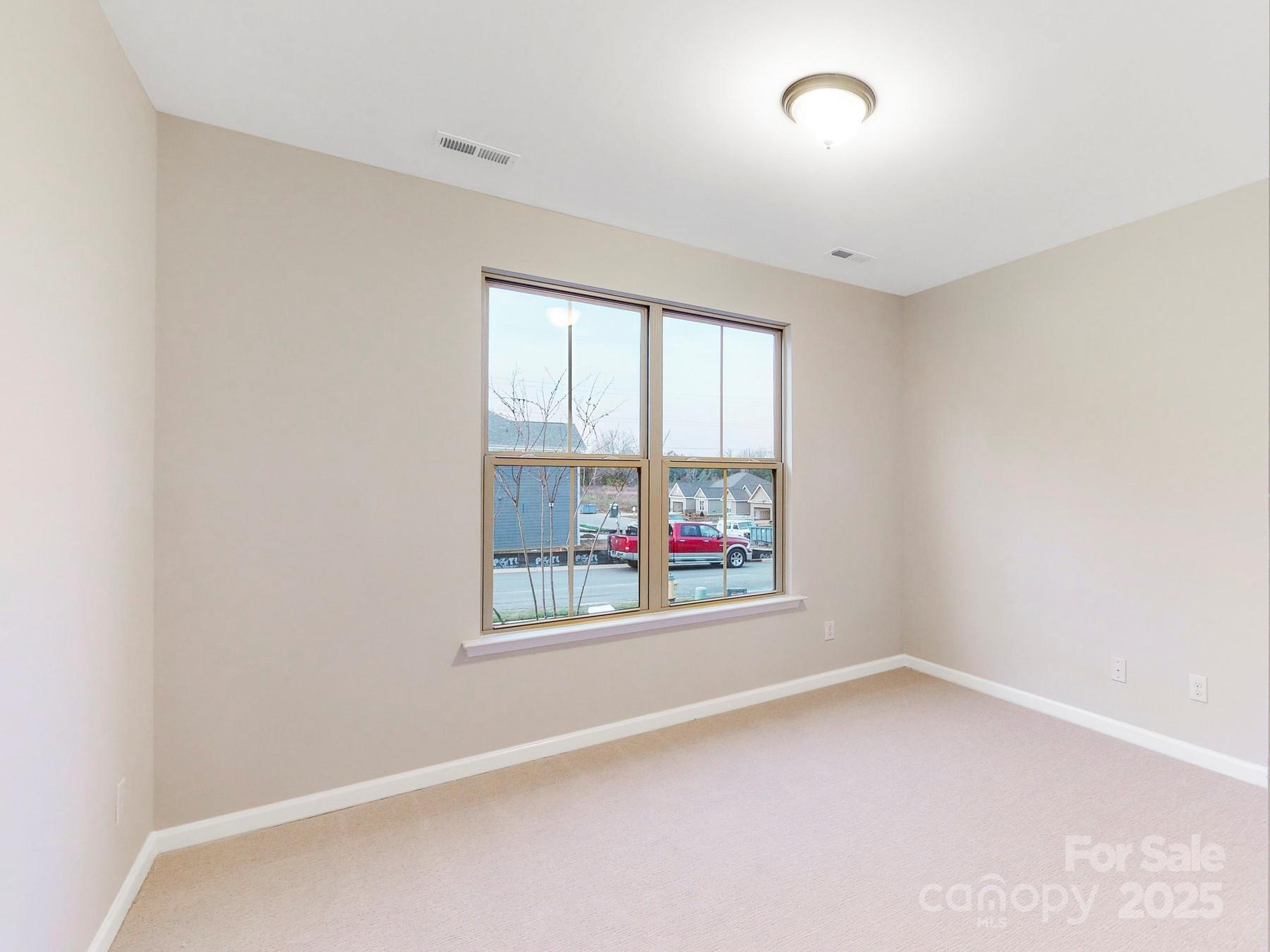 7089 Cobblefield Lane Denver, NC 28037 - Photo 16 of 36 an empty room with windows