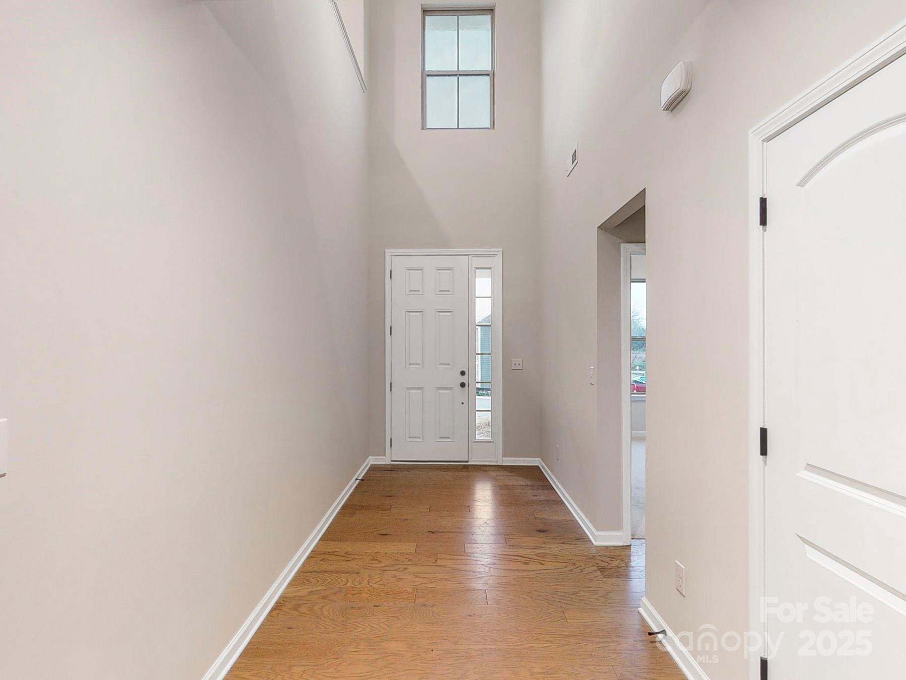 7089 Cobblefield Lane Denver, NC 28037 - Photo 19 of 36 a view of a hallway with wooden floor