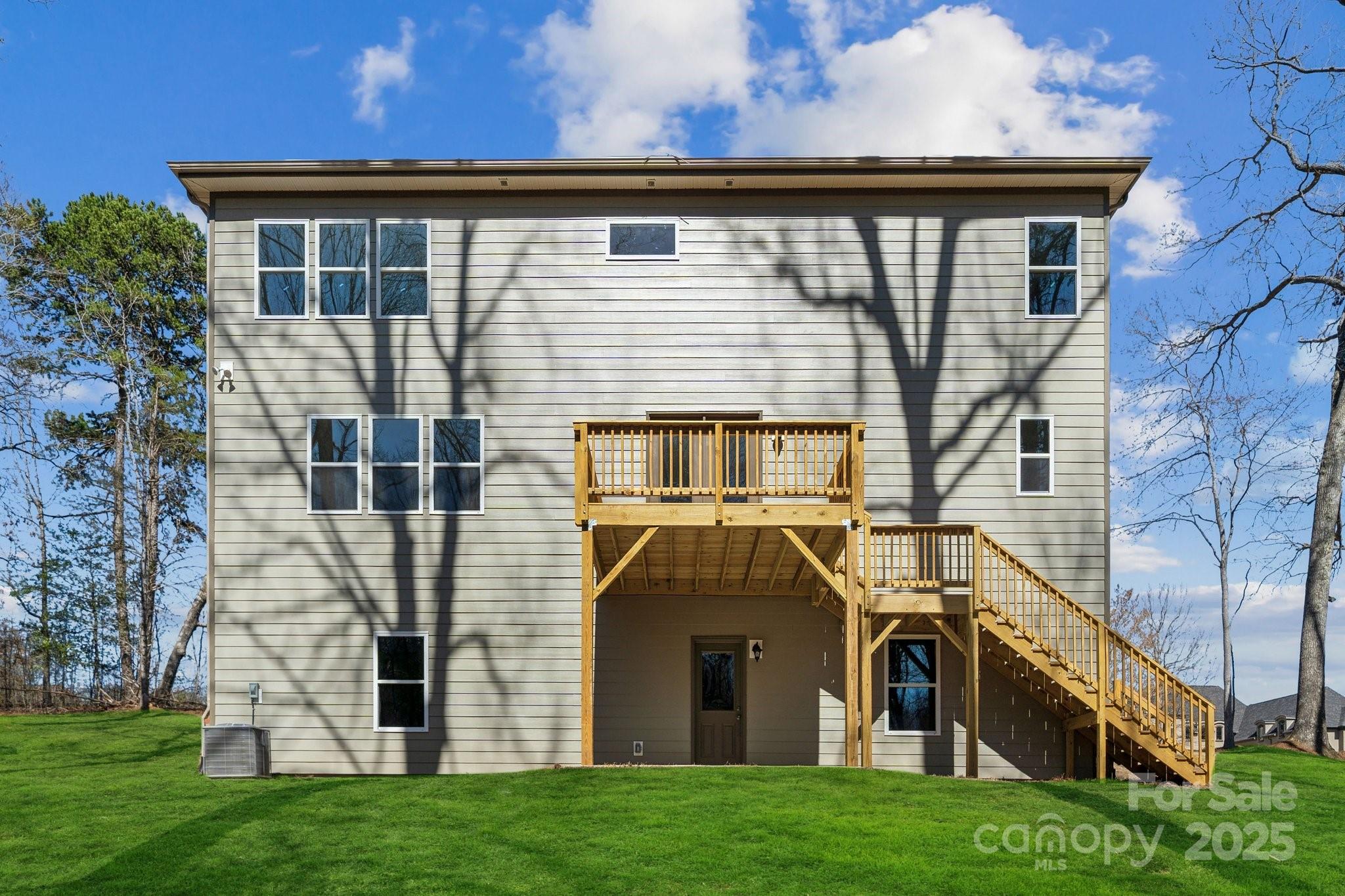 7089 Cobblefield Lane Denver, NC 28037 - Photo 2 of 36 a front view of a house with a yard