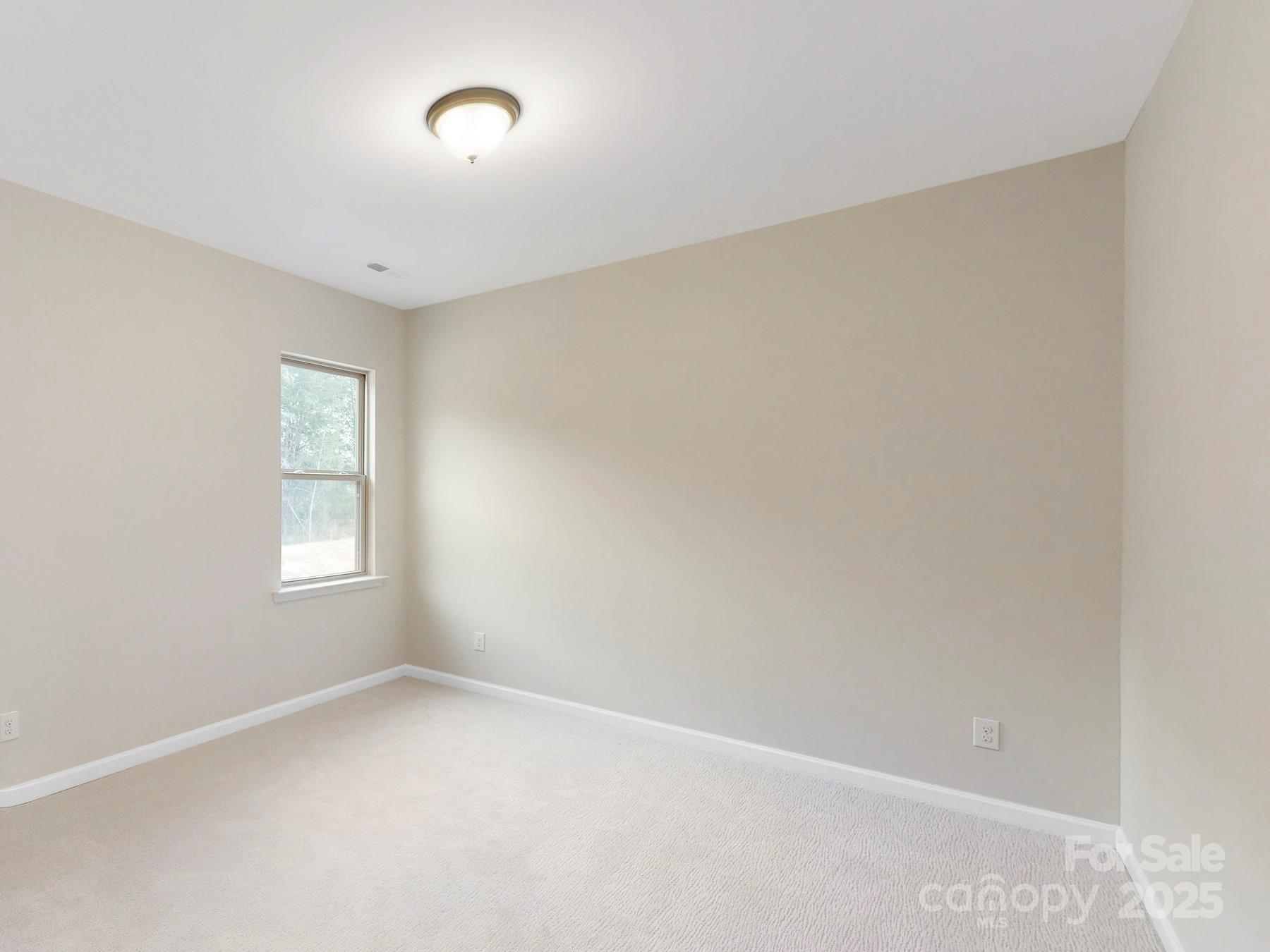 7089 Cobblefield Lane Denver, NC 28037 - Photo 22 of 36 an empty room with windows