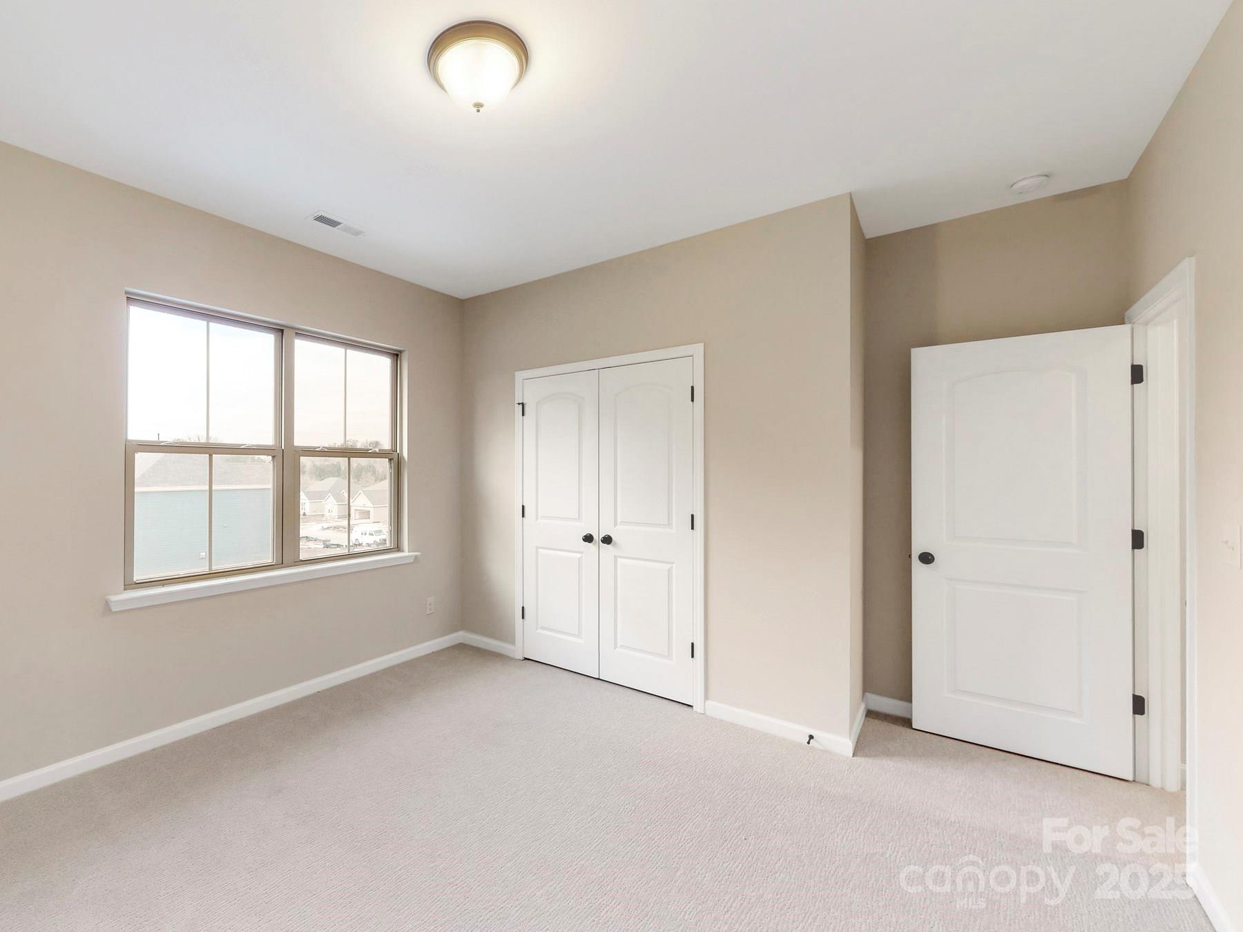 7089 Cobblefield Lane Denver, NC 28037 - Photo 25 of 36 a view of an empty room with a window