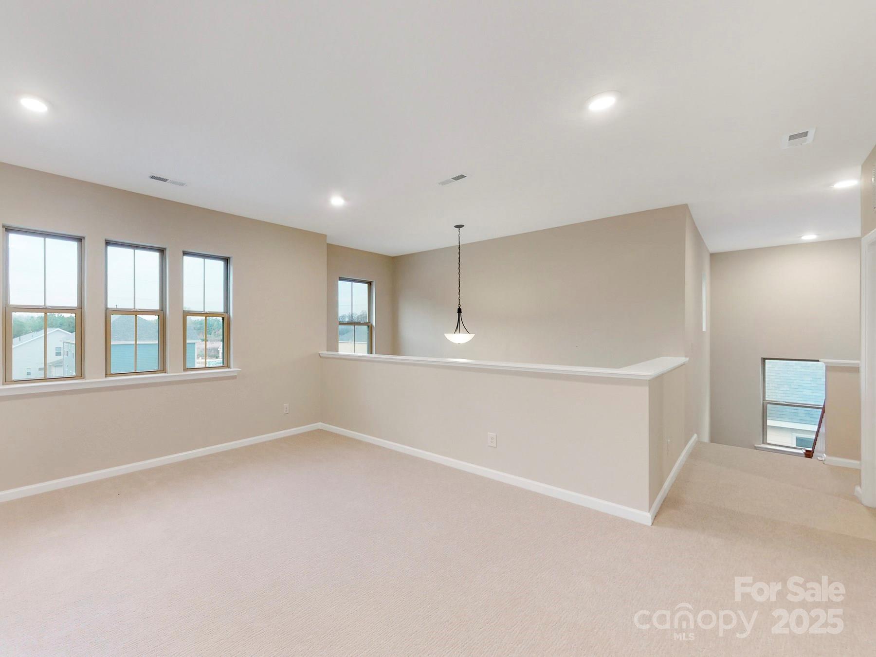 7089 Cobblefield Lane Denver, NC 28037 - Photo 28 of 36 a view of an empty room with a window