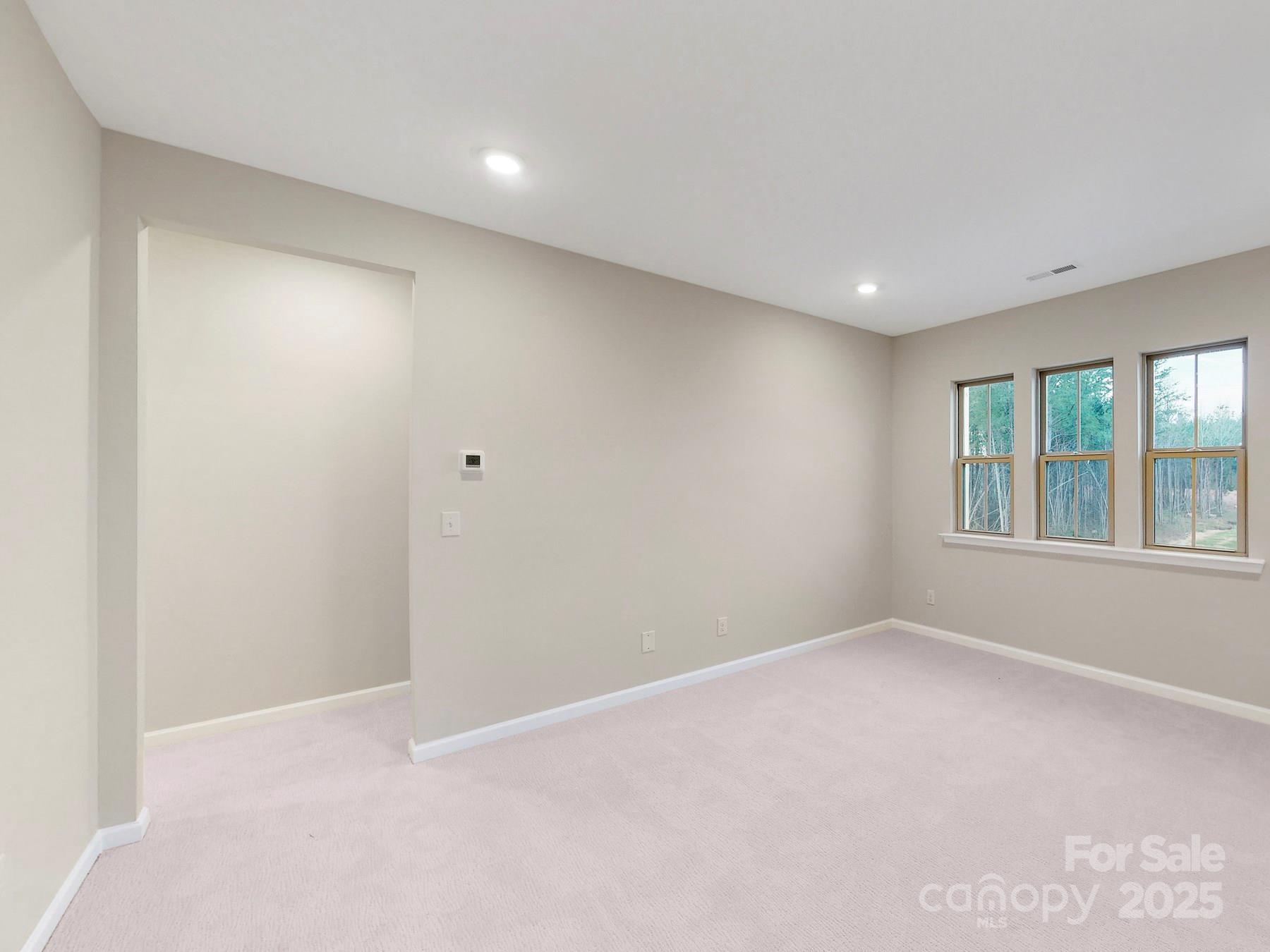 7089 Cobblefield Lane Denver, NC 28037 - Photo 31 of 36 a view of an empty room with a window