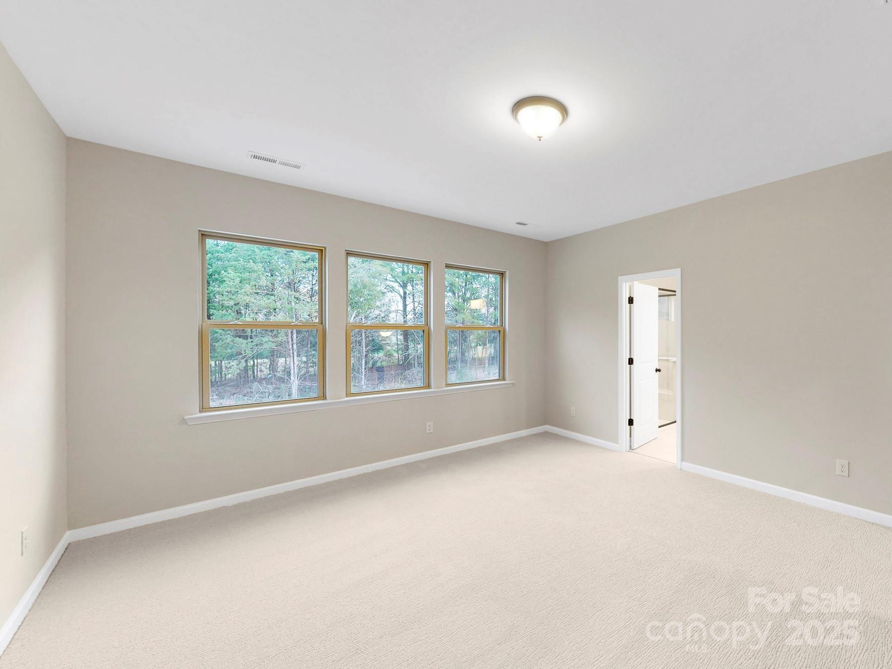 7089 Cobblefield Lane Denver, NC 28037 - Photo 34 of 36 an empty room with windows and closet