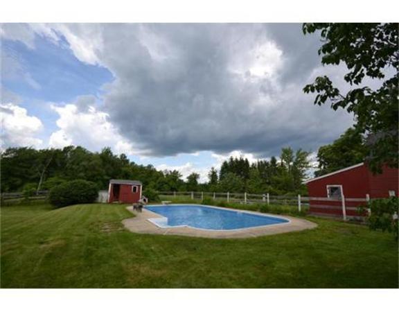 644 Northfield Road Lunenburg, MA 01462 - Photo 2 of 13 a backyard of a house with lots of green space