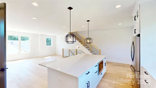 a kitchen with cabinets and a stove