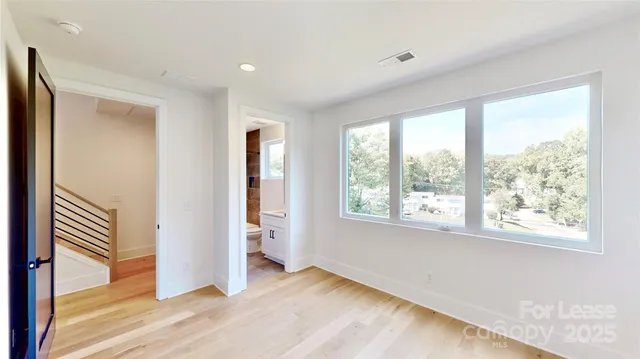 a bathroom with a bathtub shower sink vanity and toilet