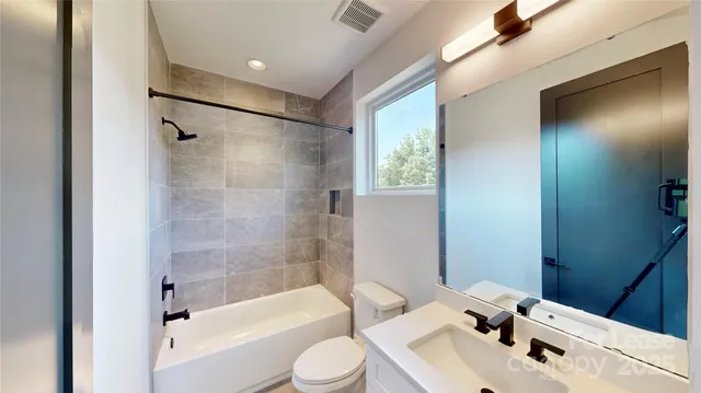 a view of a house with backyard and kitchen