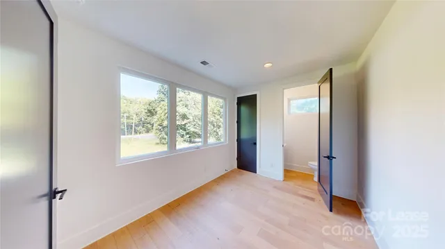 a view of a hallway with entryway and stairs