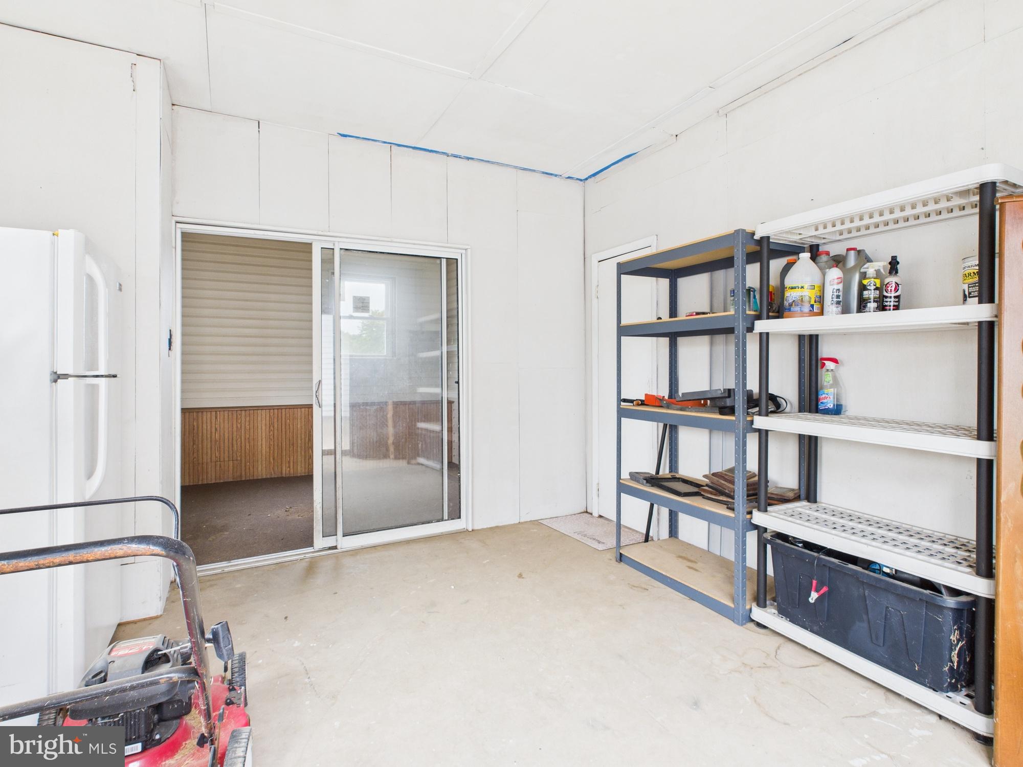 38 South Carter Road Smyrna, DE 19977 - Photo 17 of 30 a bedroom with furniture and a book shelf