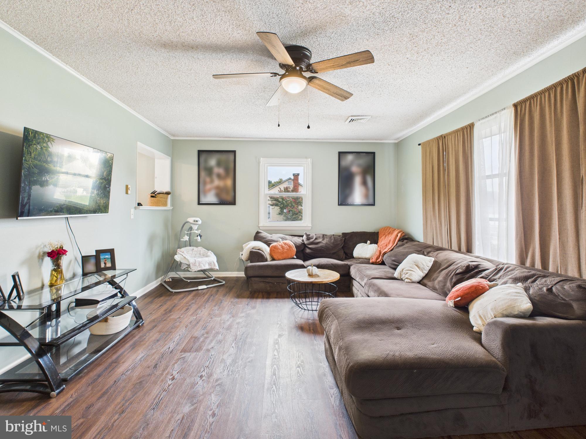 38 South Carter Road Smyrna, DE 19977 - Photo 28 of 30 a living room with furniture and a flat screen tv